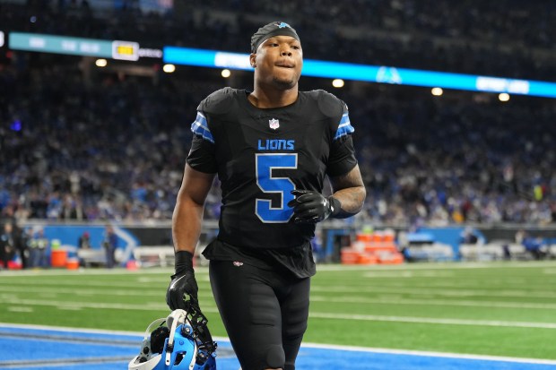 Lions running back David Montgomery jogs across the field before a game against the Bills at Ford Field on Dec. 15, 2024, in Detroit. (Nic Antaya/Getty Images)