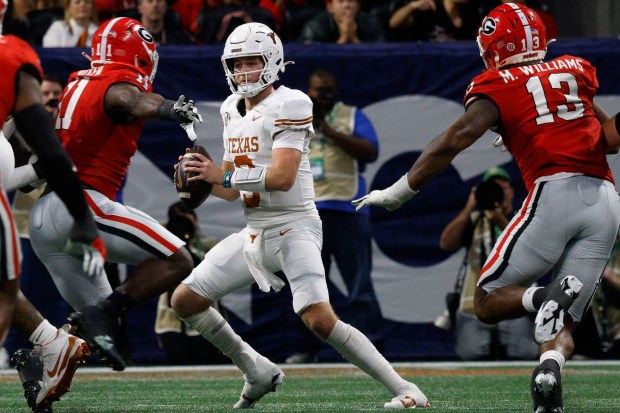 Texas quarterback Quinn Ewers looks to pass against Georgia during the SEC championship game on Dec. 7, 2024, in Atlanta. (Chitose Suzuki/The Dallas Morning News)