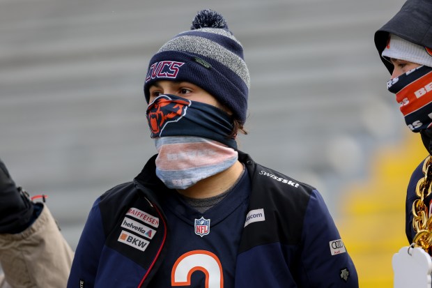 Fans watch players warm up on the field before the Chicago Bears play the Green Bay Packers at Lambeau Field Sunday Jan. 5, 2025, in Green Bay, Wis. (Armando L. Sanchez/Chicago Tribune)