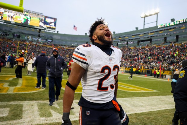 Chicago Bears running back Roschon Johnson (23) celebrates after Cairo Santos (8) kicked a 51-yard field goal to win the game against the Green Bay Packers at Lambeau Field in Green Bay, Wis., on Sunday, Jan. 5, 2025. (Eileen T. Meslar/Chicago Tribune)