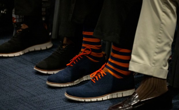 Chairman George McCaskey wears Bears socks as new coach Ben Johnson speaks after being introduced Wednesday, Jan. 22, 2025, at Halas Hall. (Brian Cassella/Chicago Tribune)