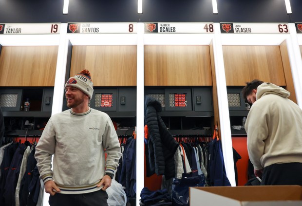 Chicago Bears place kicker Cairo Santos (8), left, cleans out his locker at Halas Hall on Jan. 6, 2025 in Lake Forest. (Stacey Wescott/Chicago Tribune)