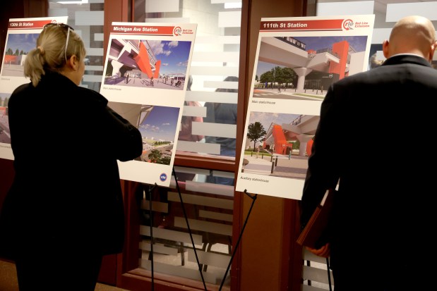 People look at renderings of the extension at the press conference and signing ceremony for the Full Funding Grant Agreement (FFGA) in Chicago, Jan. 10, 2025, which pledges $1.973 billion for the CTA Red Line Extension Project. (Antonio Perez/Chicago Tribune)