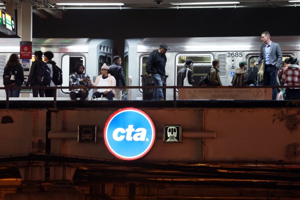 Chicago Transit Authority riders are seen on the platform of the Roosevelt Road station on Nov. 4, 2024. (Terrence Antonio James/Chicago Tribune)