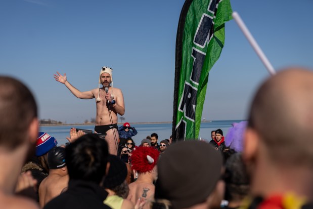 Founder of Chicago Polar Bear Club Brian Marchal makes an opening speech before the 24th annual Polar Plunge at Oak Street Beach on Jan. 25, 2025. (Audrey Richardson/Chicago Tribune)