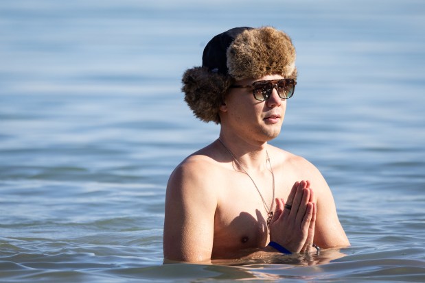 A person idles in the freezing Lake Michigan temperatures during Chicago Polar Bear Club's 24th annual Polar Plunge. (Audrey Richardson/Chicago Tribune)