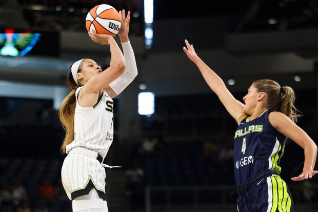 Sky guard Chennedy Carter tries to score while guarded by the Wings' Jacy Sheldon at Wintrust Arena on June 20, 2024. (Eileen T. Meslar/Chicago Tribune)