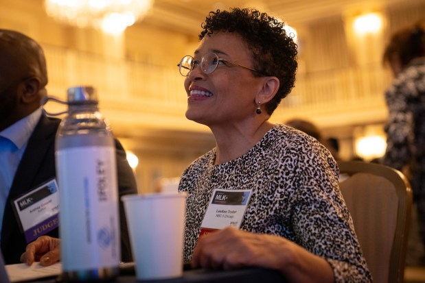 LeeAnn Trotter, a feature reporter at NBC5 Chicago, listens to opening remarks during a competing between 10 fourth- and fifth-grade students from Chicago Public Schools and the Boys & Girls Clubs of Chicago during the Lardner LLP's Annual MLK Jr. Oratory Competition at The Drake Hotel. (Audrey Richardson/Chicago Tribune)