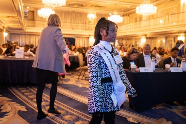 McKenzie Hudson, of Wendell Smith Elementary, makes her way on the stage while competing for the top honor at Foley & Lardner LLP's Annual MLK Jr. Oratory Competition at The Drake Hotel on Jan. 17, 2025. (Audrey Richardson/Chicago Tribune)