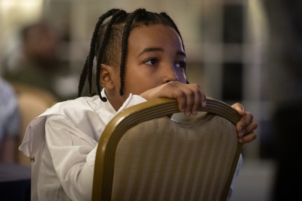 Aiden Marshall, of Boys and Girls Clubs of Chicago, listens to opening remarks before competing for the top honor at Foley & Lardner LLP's Annual MLK Jr. Oratory Competition at The Drake Hotel on Jan. 17, 2025. (Audrey Richardson/Chicago Tribune)