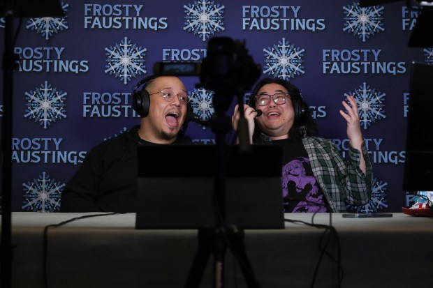 Commentators Michael Mendoza, left, and James Chen excitedly call a match in the Marvel vs. Capcom 2 video game tournament during Frosty Faustings XVII at the Westin Chicago Lombard on Jan. 24, 2025. (John J. Kim/Chicago Tribune)