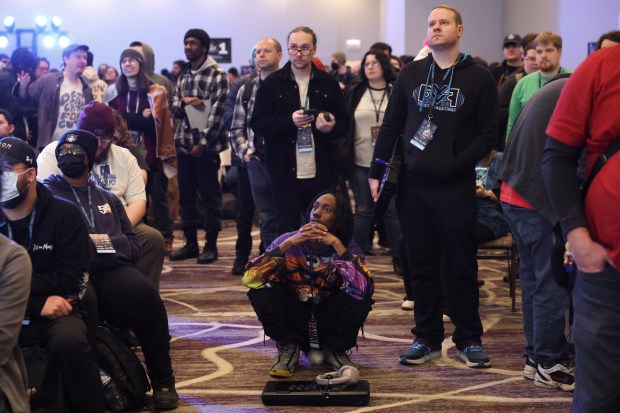 Attendees watch a match in the Marvel vs. Capcom 2 video game tournament during Frosty Faustings XVII at the Westin Chicago Lombard on Jan. 24, 2025. (John J. Kim/Chicago Tribune)