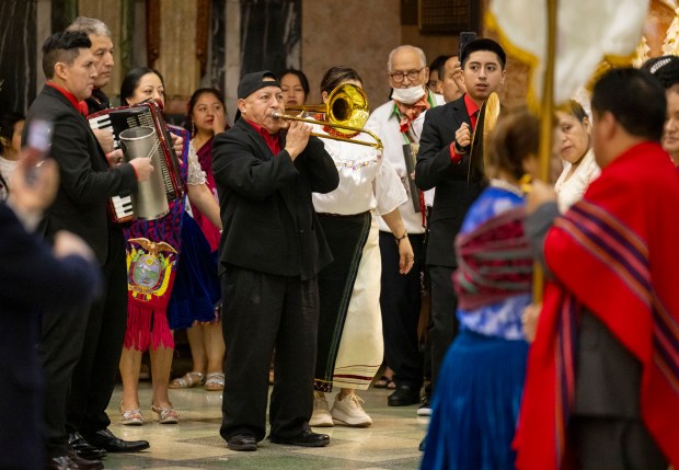 Musicians play while parishioners celebrate a Mass in honor of Nuestra Señora Virgen de la Nube, Our Lady of the Cloud, on New Year's Day, Jan. 1, 2025, at Our Lady of Mercy on the Northwest Side. (Brian Cassella/Chicago Tribune)