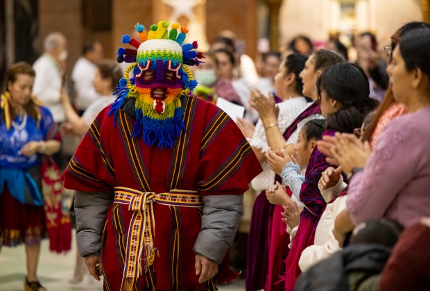 Parishioners celebrate a Mass in honor of Nuestra Señora Virgen de la Nube, Our Lady of the Cloud, on New Year's Day, Jan. 1, 2025, at Our Lady of Mercy on the Northwest Side. The Mass and processional through the Albany Park neighborhood are an annual Ecuadorian community celebration. (Brian Cassella/Chicago Tribune)