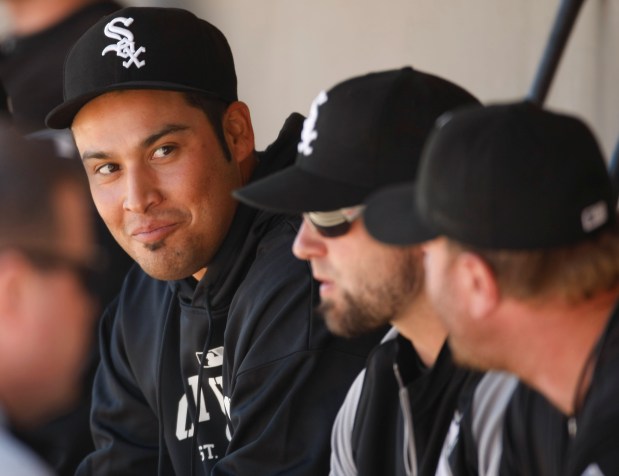 White Sox pitcher Sergio Santos, left, talks with teammates in the dugout during a spring training game against the Dodgers on Feb. 28, 2011, at Camelback Ranch in Glendale, Ariz. (Phil Velasquez/Chicago Tribune)