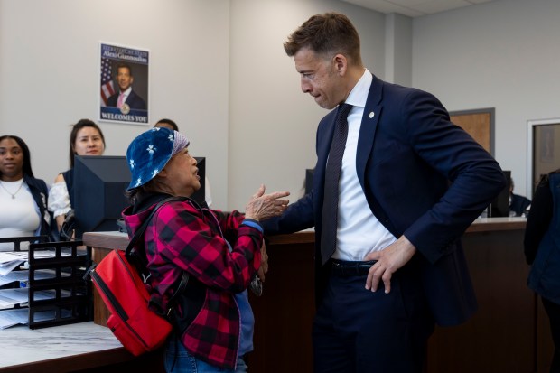 Illinois Secretary of State Alexi Giannoulias greets people after opening a new Driver and Motor Vehicle service center, the first Chicago-based "One-Stop-Shop" Express DMV on April 15, 2024, in Chinatown. (Brian Cassella/Chicago Tribune)