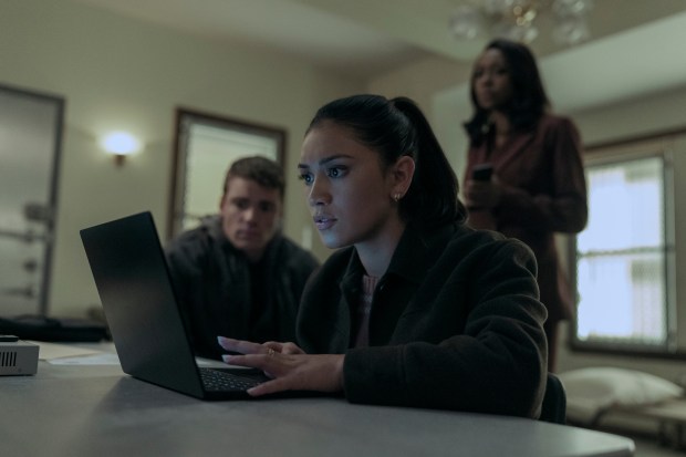 Forefront, Luciane Buchanan. In the background from left, Gabriel Basso and Amanda Warren in Season 2 of "The Night Agent. (Christopher Saunders/Netflix)