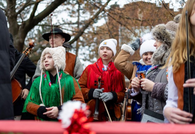 Young musicians prepare to begin a Three Kings Parade down Belmont Avenue in a float Sunday, Jan. 5, 2025, from St. Ferdinand Church in Belmont Cragin. (Brian Cassella/Chicago Tribune)