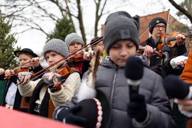 Young musicians play in a float during a Three Kings Parade down Belmont Avenue on Jan. 5, 2025, from St. Ferdinand Church in Belmont Cragin on the Northwest Side. (Brian Cassella/Chicago Tribune)