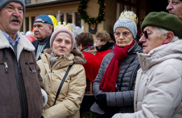 Parishioners gather after the mass for a Three Kings Parade down Belmont Avenue from St. Ferdinand Church in Belmont Cragin. (Brian Cassella/Chicago Tribune)