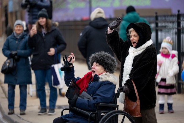 Parishioners watch a Three Kings Parade down Belmont Avenue on Jan. 5, 2025. (Brian Cassella/Chicago Tribune)