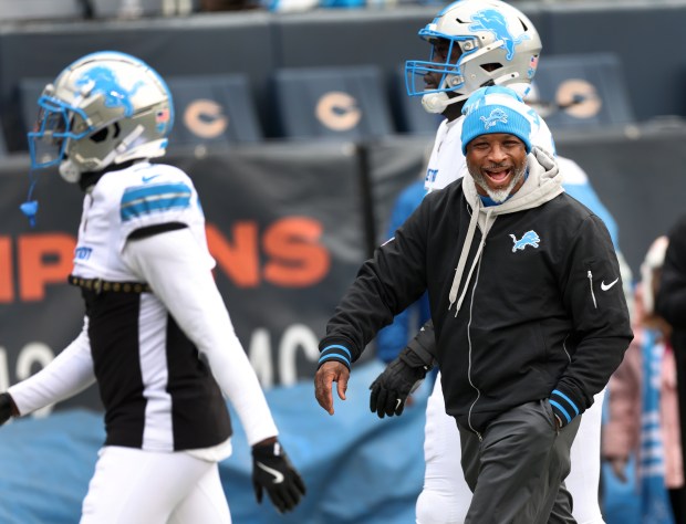 Detroit Lions defensive coordinator Aaron Glenn walks off the field after warmups before a game against the Bears at Soldier Field. (Chris Sweda/Chicago Tribune)