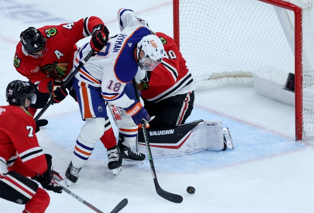 Edmonton Oilers left wing Zach Hyman (18) scores a goal on Chicago Blackhawks goaltender Arvid Soderblom (40) in the third period of a game at the United Center in Chicago on Jan. 11, 2025. (Chris Sweda/Chicago Tribune)