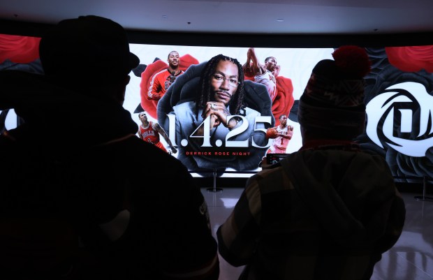 Fans gather around a video display at the United Center on "Derrick Rose Night" on Jan. 4, 2025. (Chris Sweda/Chicago Tribune)