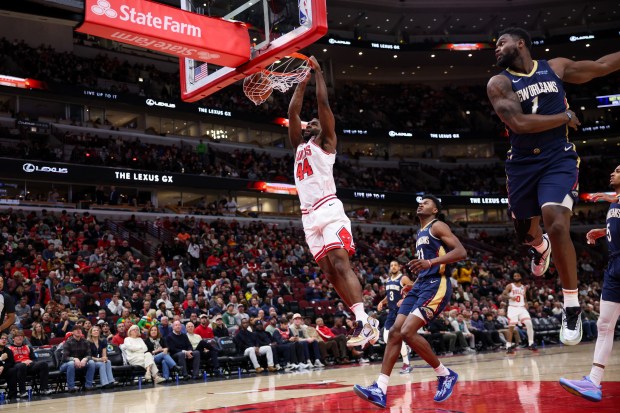 Chicago Bulls forward Patrick Williams (44) goes up for a dunk past New Orleans Pelicans forward Zion Williamson (1) during the third period at the United Center Tuesday Jan. 14, 2025, in Chicago. (Armando L. Sanchez/Chicago Tribune)