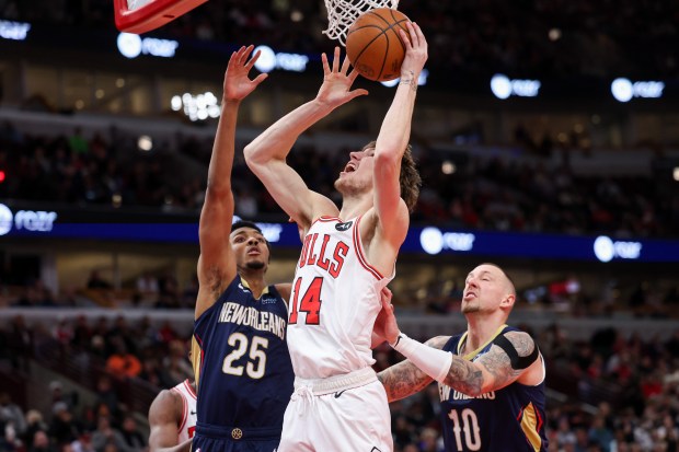 Bulls forward Matas Buzelis (14) goes up for a basket against the Pelicans on Jan. 14, 2025, at the United Center. (Armando L. Sanchez/Chicago Tribune)