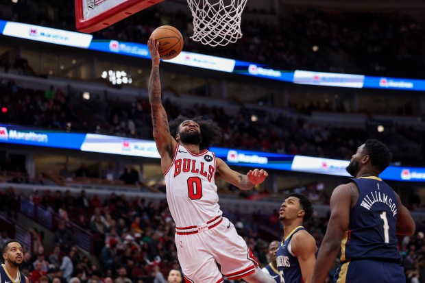 Chicago Bulls guard Coby White (0) goes up for basket during the fourth period against the New Orleans Pelicans at the United Center Tuesday Jan. 14, 2025, in Chicago. (Armando L. Sanchez/Chicago Tribune)