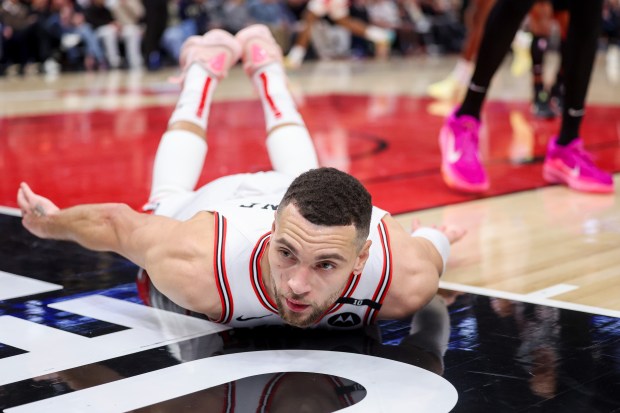 Chicago Bulls guard Zach LaVine (8) slides on the court during the fourth period against the San Antonio Spurs at the United Center Monday Jan. 6, 2025, in Chicago. (Armando L. Sanchez/Chicago Tribune)