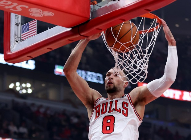 Chicago Bulls guard Zach LaVine (8) dunks the ball in the first half of a game against the Washington Wizards at the United Center in Chicago on Jan. 10, 2025.  (Chris Sweda/Chicago Tribune)