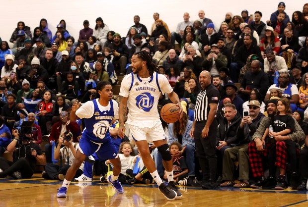 Derrick Rose plays in a game as he is honored at Simeon Career Academy in Chicago on Friday, Jan. 3, 2025. The Simeon graduate and former Chicago Bulls superstar is being honored at the United Center on Saturday night during a Bulls vs. New York Knicks game. At right is Rose's former Bulls teammate Joakim Noah. (Chris Sweda/Chicago Tribune)