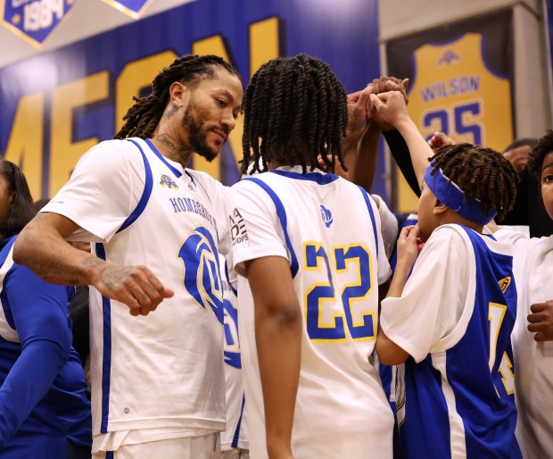 Derrick Rose huddles up with players after a friendly game with youths as Rose was honored at Simeon Career Academy in Chicago on Friday, Jan. 3, 2025. The Simeon graduate and former Chicago Bulls superstar is being honored at the United Center on Saturday night during a Bulls vs. New York Knicks game. (Chris Sweda/Chicago Tribune)