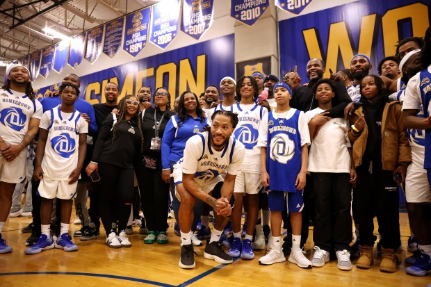 Derrick Rose poses with the Simeon Career Academy basketball community in Chicago on Friday, Jan. 3, 2025. The Simeon graduate and former Chicago Bulls superstar is being honored at the United Center on Saturday night during a Bulls vs. New York Knicks game. (Chris Sweda/Chicago Tribune)