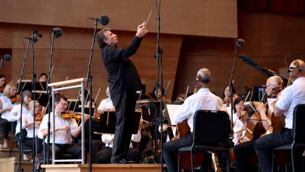 Then-guest conductor Giancarlo Guerrero leads the Grant Park Orchestra at Millennium Park's Pritzker Pavilion on July 10, 2024. (Chris Sweda/Chicago Tribune)