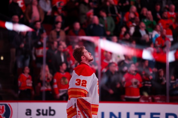 Calgary Flames goaltender Dustin Wolf (32) looks up during the Canadian national anthem before the first period against the Chicago Blackhawks at the United Center Monday Jan. 13, 2025, in Chicago. (Armando L. Sanchez/Chicago Tribune)