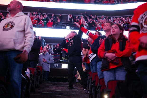 Fans cheer during the national anthem before the Chicago Blackhawks play the first period against the Calgary Flames at the United Center Monday Jan. 13, 2025, in Chicago. (Armando L. Sanchez/Chicago Tribune)