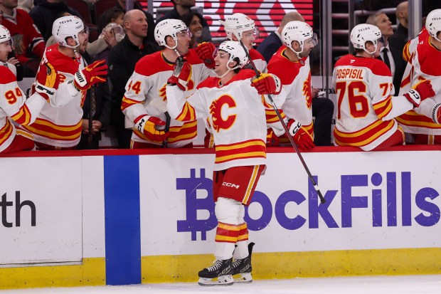 Calgary Flames left wing Jakob Pelletier (22) celebrates after scoring during the first period against the Chicago Blackhawks at the United Center Monday Jan. 13, 2025, in Chicago. (Armando L. Sanchez/Chicago Tribune)