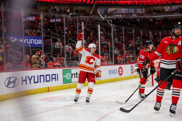 Calgary Flames left wing Jakob Pelletier (22) celebrates after Calgary Flames defenseman Jake Bean (24) scored a goal during the second period against the Chicago Blackhawks at the United Center Monday Jan. 13, 2025, in Chicago. (Armando L. Sanchez/Chicago Tribune)