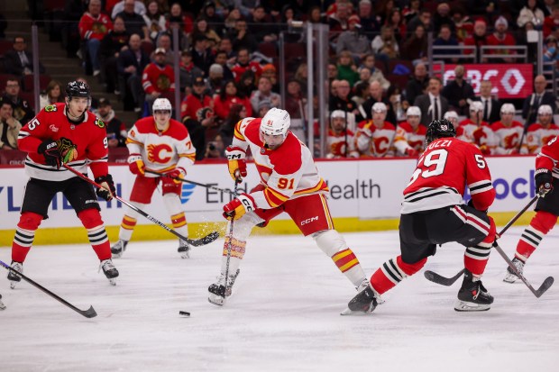 Calgary Flames center Nazem Kadri (91) handles the puck during the second period against the Chicago Blackhawks at the United Center Monday Jan. 13, 2025, in Chicago. (Armando L. Sanchez/Chicago Tribune)