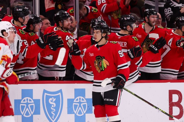 Chicago Blackhawks center Connor Bedard (98) celebrates with his team after scoring a goal during the second period against the Calgary Flames at the United Center Monday Jan. 13, 2025, in Chicago. (Armando L. Sanchez/Chicago Tribune)