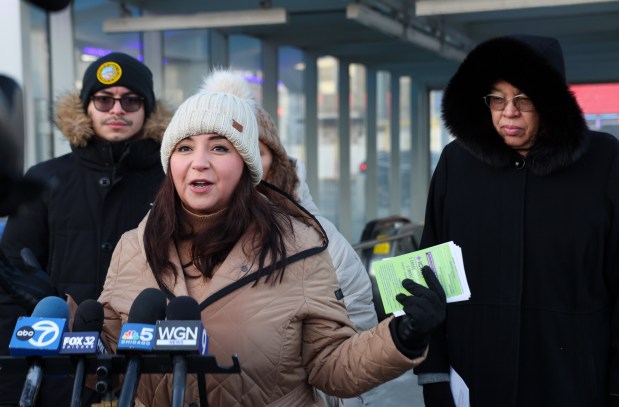 U.S. Rep. Delia C. Ramirez foreground, speaks with other politicians including Cook County Board President Toni Preckwinkle, right, about immigrant rights and protections outside of the Blue Line station in the Avondale neighborhood on Jan. 20, 2025, in Chicago. (Stacey Wescott/Chicago Tribune)