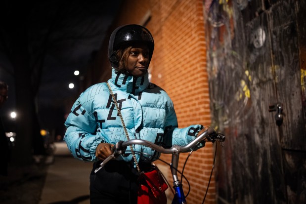 Lakeview High School student Kaniyah Hale tests out the bike she is building at the After School Matters program at West Town Bikes in the Humboldt Park neighborhood, Dec. 3, 2024. (E. Jason Wambsgans/Chicago Tribune)