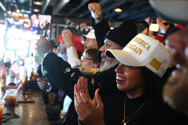 Donald Trump supporters celebrate at an inauguration watch party at Danny's Pizza Place in Chicago, Jan. 20, 2025. (Antonio Perez/Chicago Tribune)