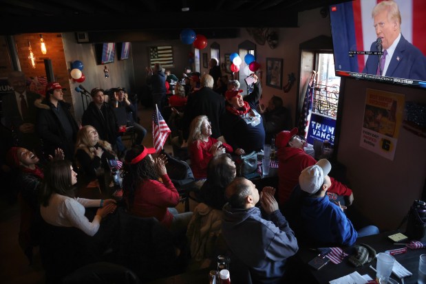 Dozens of Donald Trump supporters watch Trump's inauguration at Danny's Pizza Place in Chicago, Jan. 20, 2025. (Antonio Perez/Chicago Tribune)