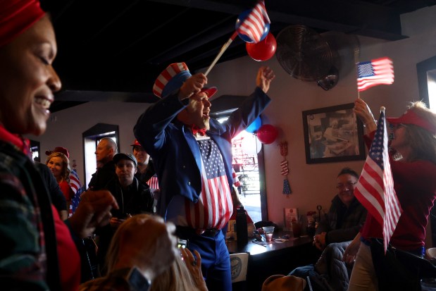 David Dewar, portraying Uncle Sam, celebrates at a Donald Trump inauguration watch party at Danny's Pizza Place in Chicago, Jan. 20, 2025. (Antonio Perez/Chicago Tribune)