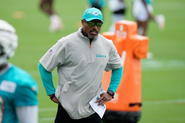 Dolphins defensive coordinator Anthony Weaver watches players at training camp on July 24, 2024, in Miami Gardens, Fla. (AP Photo/Lynne Sladky)