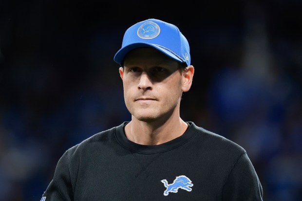 Lions offensive coordinator Ben Johnson watches during warmups before a playoff game against the Commanders on Jan. 18, 2025, at Ford Field in Detroit. (Rey Del Rio/AP)